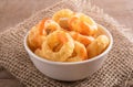 Corn rings on wooden background