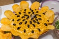 Corn salad decorated with potato chips and olives Royalty Free Stock Photo