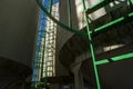 Corn seed storage bins with ladders at elevator grain operation in the Midwest surrounded by corn fields