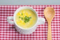 Corn soup in white bowl