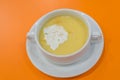 Corn Soup in white bowl on orange background Royalty Free Stock Photo