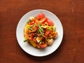 Corn Spicy salad with egg in white dish on wooden table.Thai Traditional And Popular Food Royalty Free Stock Photo