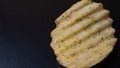 Potato chips on a black table Royalty Free Stock Photo