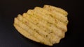 Potato chips on a black table Royalty Free Stock Photo