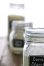 Corn starch in a jar with other baking ingredients on out of focus background Royalty Free Stock Photo