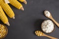 Corn starch in wooden bowl and spoon with dried corn groats Royalty Free Stock Photo