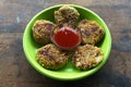 Corn Tikki seasoned with Sesame, shallow fried with Garlic Butter on a Plate and Tomentosus Lokgram Kalyan