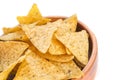 Corn tortillas or nachos, fried over an open fire, lie in a wooden bowl. Copy space