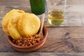 Corn tortos with picadillo and fried egg. Bottle and glass of Asturian cider.