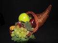 cornacopia with assorted fruits. wicker basket horn shaped Royalty Free Stock Photo