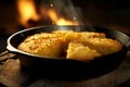 Cornbread baking in a castiron skillet capturing