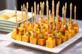 cornbread cubes on toothpicks for hors doeuvres