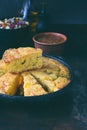 Cornbread and other mexican food - salsa with tomato, red onion, lime, cilantro, corn and hot pepper sauce. Copy space.