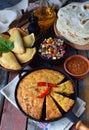 Cornbread and other mexican food - tacos, salsa with tomato, red onion, lime, cilantro, corn and hot pepper sauce, empanadas. Copy