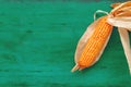 Corncob on rustic wooden background, top view Royalty Free Stock Photo