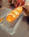 Corndog with mozzarella cheese inside and drizzled with cheese and mayonaise on top. Korean popular snacks