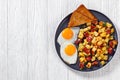 Corned Beef Hash Browns with fried eggs, top view Royalty Free Stock Photo