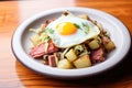 corned beef hash with cabbage and fried egg on top Royalty Free Stock Photo