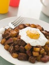 Corned Beef Hash With a Fried Egg and Black Pepper Royalty Free Stock Photo