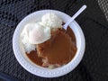 Corned Beef Hash With gravy, over easy egg and rice Royalty Free Stock Photo