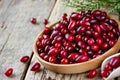 Cornelian cherry dogwood or cornus mas on a wooden background cl