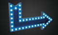 Blue arrow sign with electrical bulbs on dark background Royalty Free Stock Photo