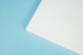 Corner of blank canvas on blue background. Royalty Free Stock Photo