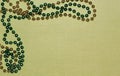 Corner Border Shiny Gold and Green Beads on Light Green Background with Lots of Copyspace