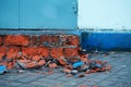 The corner of the brick plinth collapsed due to the impact of the external environment. Royalty Free Stock Photo
