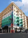 Corner building with street art paintings on the walls to Rome in Italy.