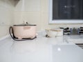 Corner cabinets in the kitchen and range hoods and faucets in the sink