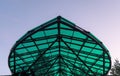 The corner of the canopy above the entrance to the city park against the sky