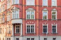 Corner of a city tenement house. Richly decorated facade made of red brick. Fragment of the town hall building in Siemianowice, Royalty Free Stock Photo