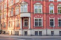 Corner of a city tenement house. Richly decorated facade made of red brick. Fragment of the town hall building in Siemianowice, Royalty Free Stock Photo