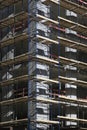 Corner of concrete building under construction with scaffolding Royalty Free Stock Photo