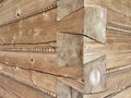Corner connection of wooden log house. Timber house wall Royalty Free Stock Photo