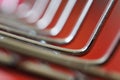 Corner diagonal metal construction on a red background. Chrome shiny elements. Shallow depth of field. Technology and industry Royalty Free Stock Photo