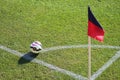 Corner flag with ball on a soccer field in Genoa, Italy.