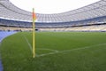 Corner flag on a football field of a stadium and empty stands