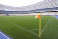 Corner flag on a football field of a stadium and empty stands