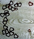 Corner frame border of Hearts on wooden background. Royalty Free Stock Photo