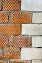 The corner of the house is made of bricks with a decorative corner element Royalty Free Stock Photo