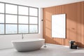 Corner Interior of modern bathroom with wooden wall, comfortable white bathtub. Poster on wall mockup