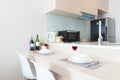 Corner kitchen with dining table in modern condominium Royalty Free Stock Photo