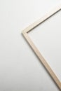 Corner made with raft wood sticks with black screw on a white table. Stop to make a frame. Royalty Free Stock Photo