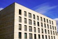 Corner of modern building with many windows against the blue sky and cloud Royalty Free Stock Photo