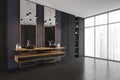 Corner of modern panoramic bathroom with gray tiled walls concrete floor double sink standing on wooden countertop with square