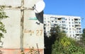 The corner of a multi-storey panel building with the street name and house number Shchorsa 27, the new name of Soborna street 27 i