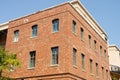 Corner of old Brick Building with Windows Royalty Free Stock Photo