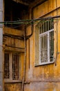 A corner of old building facade of typical houses in Odessacity center old town yards. Huge vintage windows, dirty
